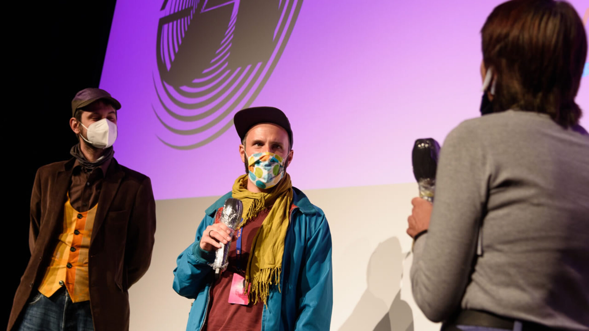 Director Benjamin Rost (center) and producer Mark Szilagyi present A PORTRAIT ON THE SEARCH FOR HAPPINESS.